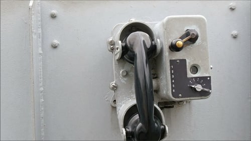 Retro Phone Mounted on Metallic Wall