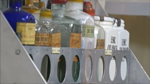 Antique Jars and Bottles on Display Shelves