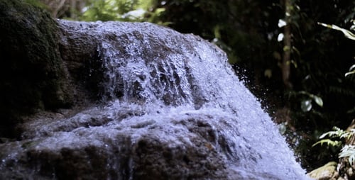 Beautiful Nature Waterfall On A Small Lake