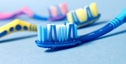 Toothpaste Squeezed onto a Blue Toothbrush