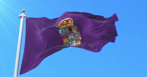 Waving Purple Flag with Historical Coat of Arms Against Blue Sky