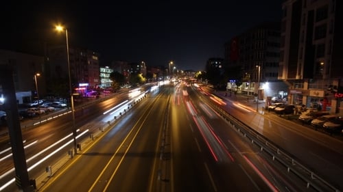Night Highway With Car Traffic And Blurry Lights