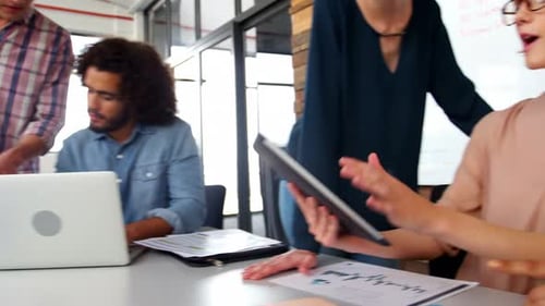 Creative Team Collaborating on a Project at Workplace