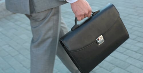 Businessman going down the road
