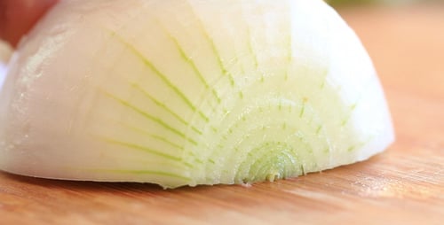 White Onion Sliced on Cutting Board, Macro Shot