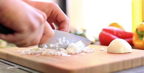 Chopping Fresh Onion and Colorful Vegetables for Cooking