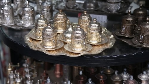 Metallic Coffee Grinders and Tea Sets on Display
