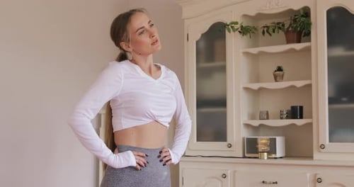 Woman Stretching Neck Muscles Indoors