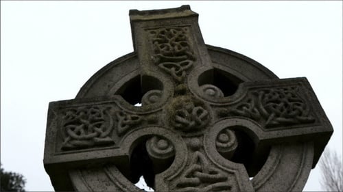 Black Mossy Tombstone in the Cemetery