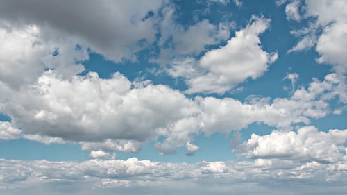 Time Lapse of Fluffy White Clouds in Blue Sky