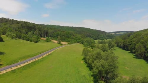 small road passing through beautiful countryside