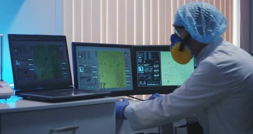 Scientist Working With Technology in Lab Environment