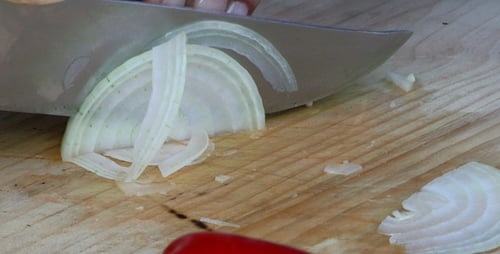Slicing An Onion on a Cutting Board