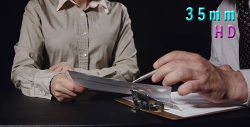 Professional Meeting at Desk with Paperwork