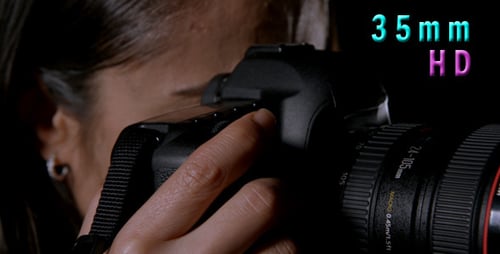 Woman Using Camera Close-Up Dark Background