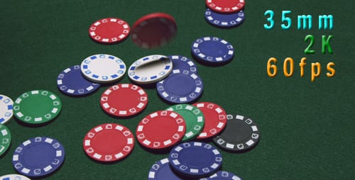 Casino Chips Falling Onto Green Game Surface
