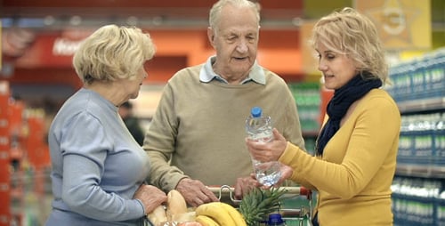 Family Shopping for Groceries Together in Supermarket