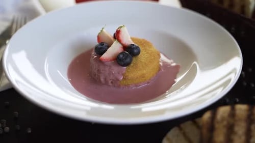 Delicious Dessert Topped with Strawberries and Blueberries
