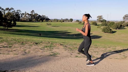 Mixed ethnicity woman working out in the park