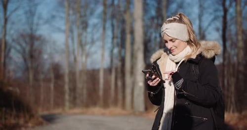 Woman Writing Message on Cell Phone During Trip