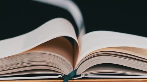 Pages Turning Rapidly Inside Thick Open Book