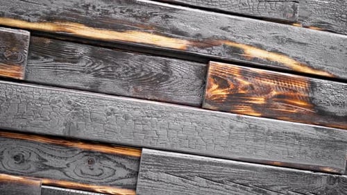 Background of Charred Boards Rotates. The Backdrop of Ruined House Is Spinning.