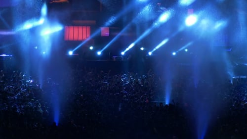 Crowd Enjoys Concert with Blue Stage Lights