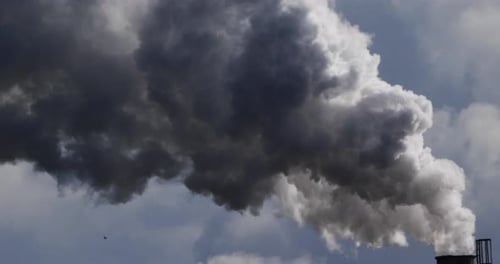Billowing Smoke Spewing From Industrial Smokestack