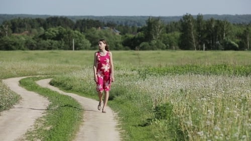 Girl Walking By Road In Field