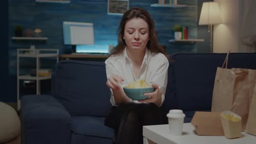 Portrait of Caucasian Woman Eating Chips From Bowl