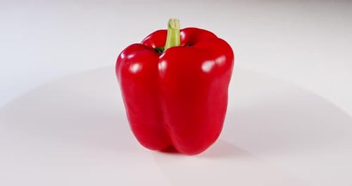 close up a Red bell pepper rotating on a white background