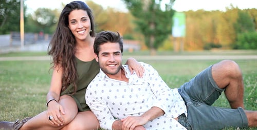 Loving Couple Relaxing Together in a Green Park