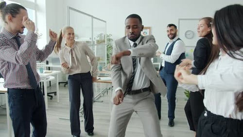 Office Workers Celebrate with a Dance Party