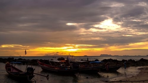 4K. Time Lapse. Traditional Thai Boats At Sunset