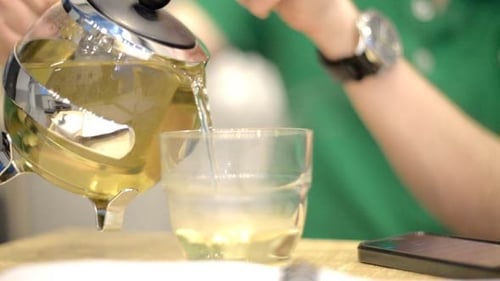 Young Man Pouring Tea
