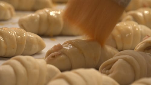 Glazing Croissants with a Light Liquid Before Baking