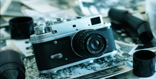 Vintage Camera on Photographs Close Up Still Life