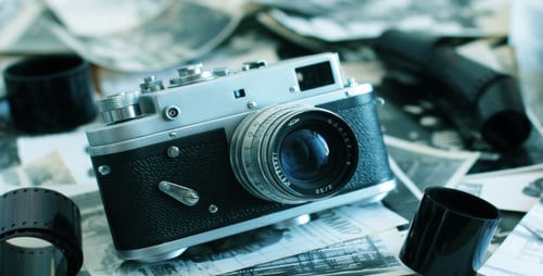 Vintage Camera with Old Film and Photos