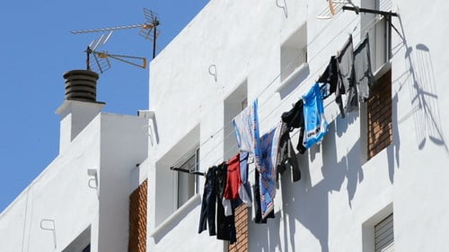 Clothes Drying on Exterior Building During Day