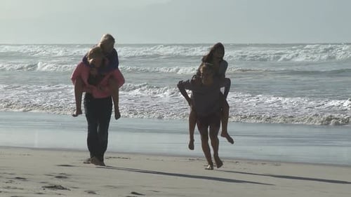 Friends Piggyback Ride on the Beach, Sunny Day