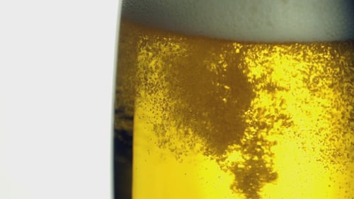 Refreshing Beer Being Poured into a Glass