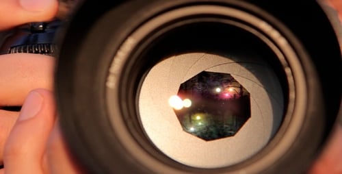 Camera Lens Adjusting Aperture in Extreme Close Up