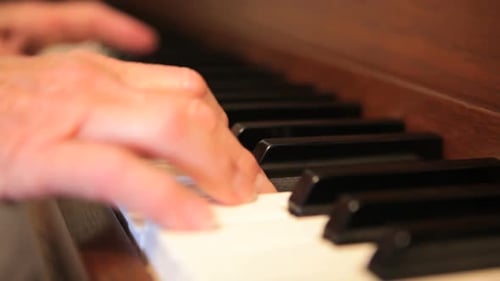 Senior Adult Playing Piano Close Up