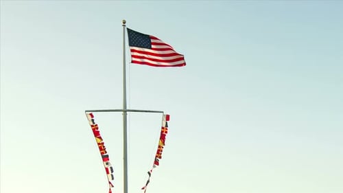 US Flag Waving with Colored Flags Below