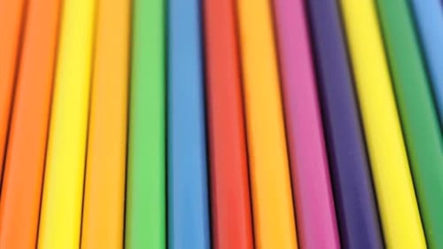 Brightly Colored Pencils Arranged in a Row
