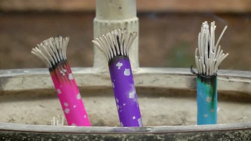 Colourful Burned Incense Sticks in Ashtray with Smoke