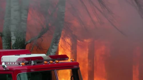 Fire Engine In Front Of Building On Fire