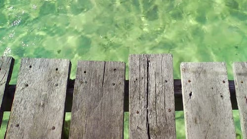 Wooden Pier And Tropical Water