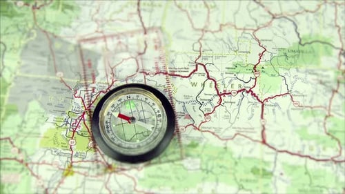 Close Up of Compass on Road Map