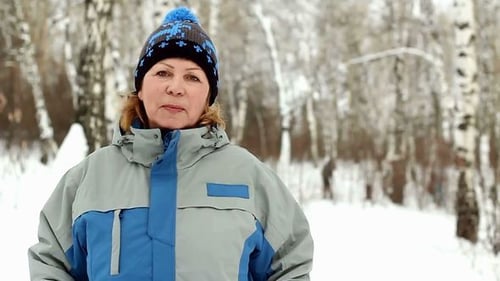 Senior Woman Outside in Winter Landscape